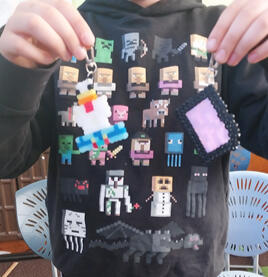 Minecraft fan with his Minecraft key tags he made